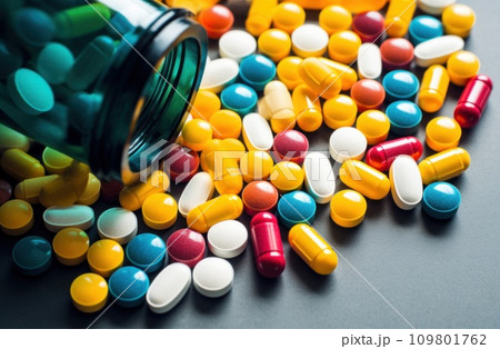 one bottle of medicine with multicolored pills one bottle of medicine with multicolored pills 109801762