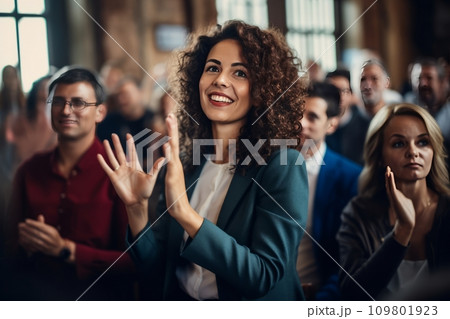 young businesswoman raises hand during audience question day 109801923