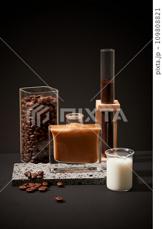 Ingredients for brewing milk coffee showcased against a black backdrop. Consistent consumption of caffeinated coffee is linked to lower risks of diabetes. Copy space. Ingredients for brewing milk coffee showcased against a black backdrop. Consistent consumption of caffeinated coffee is linked to lower risks of diabetes. Copy space. 109808821