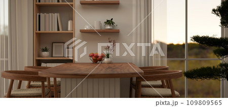 Interior design of a comfortable Scandinavian dining room with a minimal wooden dining table. 109809565