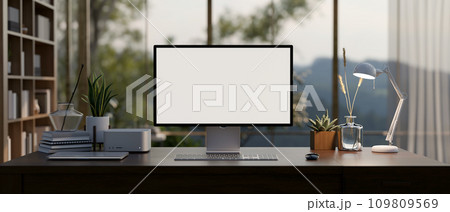 A modern private office room with a computer mockup on a desk, large glass window on the back. 109809569
