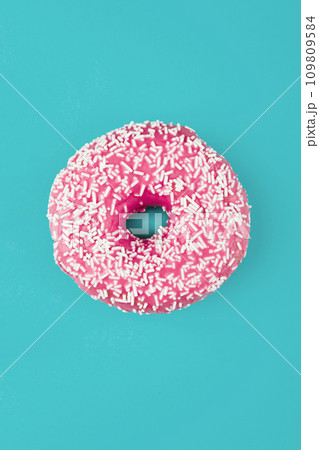 Pink donut on color background, flat lay, top view Pink donut on color background, flat lay, top view 109809584