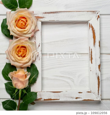 The wooden background has roses placed next to it in a rectangular frame 109812056