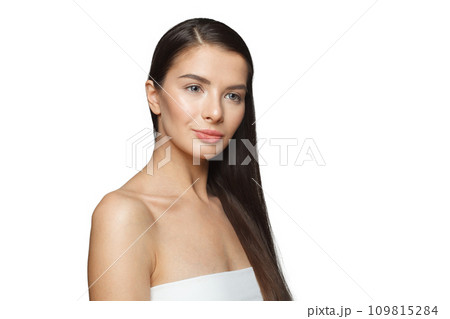 Isolated young female model woman with long healthy dark brown hair, shiny fresh skin 109815284