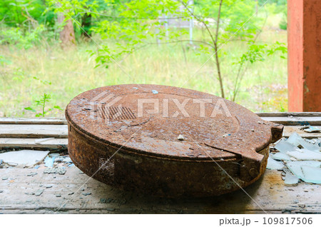Old rusty film box on windowsill in former House of Culture in resettled village of Pogonnoye in exclusion zone of Chernobyl, Belarus 109817506