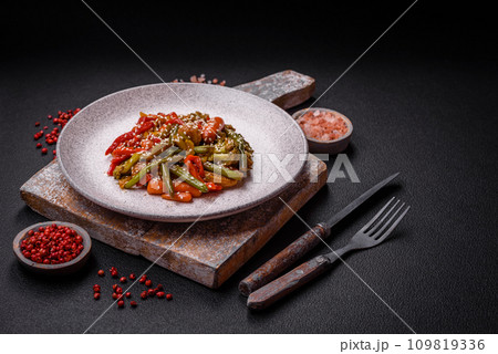 Mix of vegetables corn, carrots, peppers, broccoli, onions in teriyaki sauce 109819336