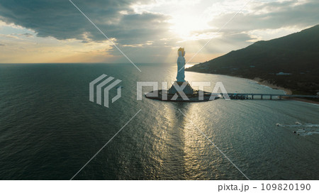 Goddess of mercy statue at seaside in nanshan temple, hainan island ,nanshan temple is a famous tourist destination in sanya,hainan province,china. Goddess of mercy statue at seaside in nanshan temple, hainan island ,nanshan temple is a famous tourist destination in sanya,hainan province,china. 109820190