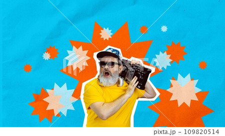 Young soul. Senior stylish man listening to music with retro music player over blue background. Creative design. Young soul. Senior stylish man listening to music with retro music player over blue background. Creative design. 109820514