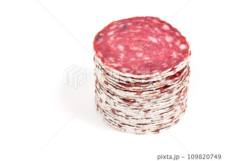 Slices of salami sausage on a white background 109820749