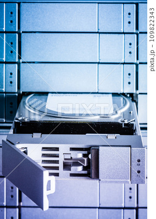 detail of hard disk in a tray that is being installed inside data storage array 109822343