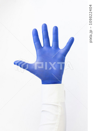 Opened palm, hand in blue latex Glove .Copy space, white background 109822404