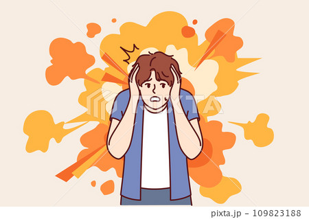 Frightened man gets scared by explosion and covers ears with hands to avoid stunning or concussion 109823188