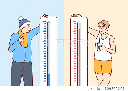 Man stands near thermometers showing different temperatures and feels heat or cold 109823261