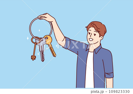 Man holds bunch keys from house and smiles, feeling safety thanks presence reliable locks 109823330