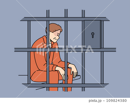 Man criminal sits in prison cell and is sad because unfair court decision or lack right to amnesty 109824380