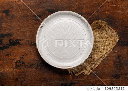 Mockup for a delicious meal. Empty plate on a table 109825811
