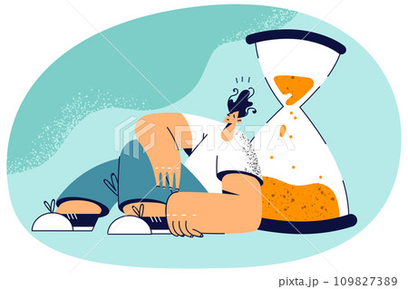 Tired man near sandglass 109827389