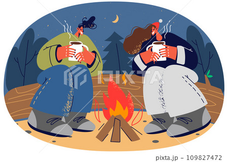 Happy couple relax near campfire in forest 109827472