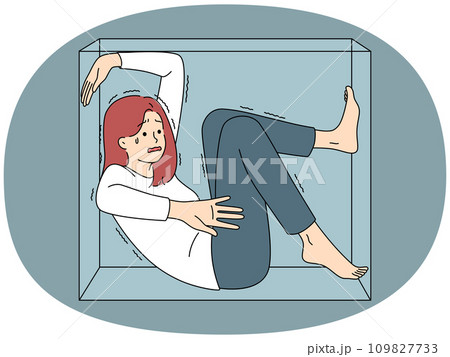 Stressed woman scared sitting in box 109827733