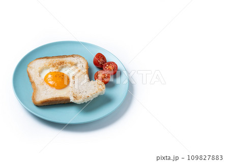 Valentine's Day breakfast with egg with tomatoes, heart shaped and toast bread isolated on white background Valentine's Day breakfast with egg with tomatoes, heart shaped and toast bread isolated on white background 109827883