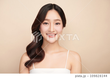 Beautiful young asian woman with clean fresh skin on beige background, Face care, Facial treatment, Cosmetology, beauty and spa, Asian women portrait. 109828144