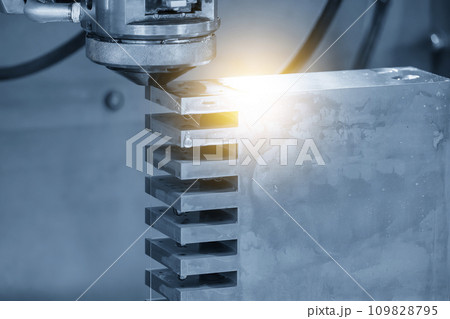 Closeup scene the wire EDM machine cutting the mold insert parts with lighting effect. 109828795