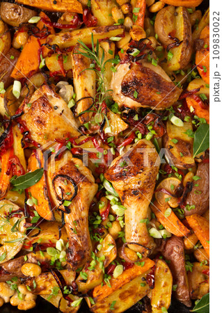 Baked vegetables with ruddy baked chicken, copy space Baked vegetables with ruddy baked chicken, copy space 109830022