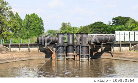 Black water pumps pipes are in the small river 109830564