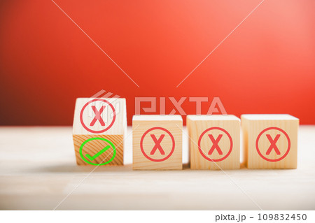 Business solution and decision-making concepts. Wood sphere flips from red wrong symbols to green checkmark symbolizing change from wrong to right on wooden cubes. Think With Yes Or No Choice. 109832450