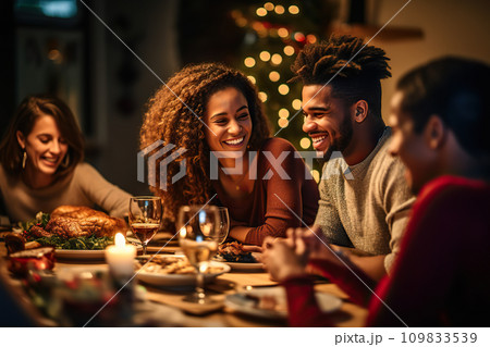 Festive Togetherness Joyful Multicultural Friends Enjoying a Heartwarming Christmas Dinner Celebration at Home. created with Generative AI 109833539