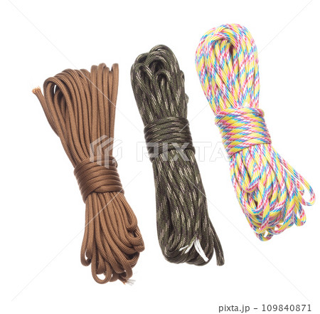 Pack group Climbing Rope roll fly in air. Strong safety climbing rope for sport mountain hobby, need safety gear to lock hold weight of climber rope. White background isolated 109840871