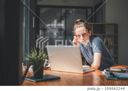 Overworked businesswoman suffering from headache and thinking how to end work. Overworked businesswoman suffering from headache and thinking how to end work. 109842244