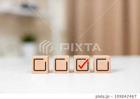 Wooden cubes with check mark icon. Human resource. Quality Control. Task list goals success Wooden cubes with check mark icon. Human resource. Quality Control. Task list goals success 109842467