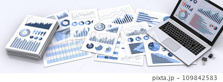 ノートパソコンと山積みにしたビジネス資料、事業戦略の構築やデータ分析のイメージ 109842583