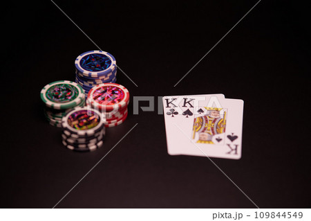 The interior of the casino. Playing cards close-up at the poker table combination of cards a pair of kings. The interior of the casino. Playing cards close-up at the poker table combination of cards a pair of kings. 109844549
