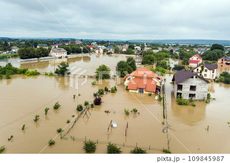 Aerial view of flooded houses with dirty water of Dnister river in Halych town, western Ukraine. Aerial view of flooded houses with dirty water of Dnister river in Halych town, western Ukraine. 109845987