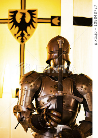 knightly armor of a German knight with a sword in his hand knightly armor of a German knight with a sword in his hand 109848727