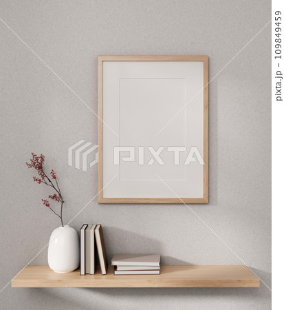 Front view of a picture frame mockup and a wooden wall shelf with home decor on a white wall. Front view of a picture frame mockup and a wooden wall shelf with home decor on a white wall. 109849459
