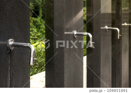 A row of water tap ablution places for Muslims A row of water tap ablution places for Muslims 109851891