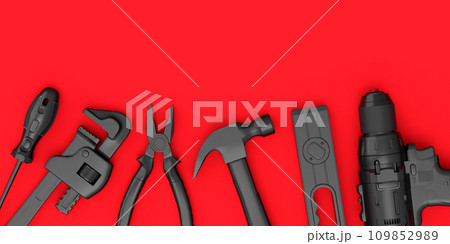 Top view of monochrome construction tools for repair on red background 109852989