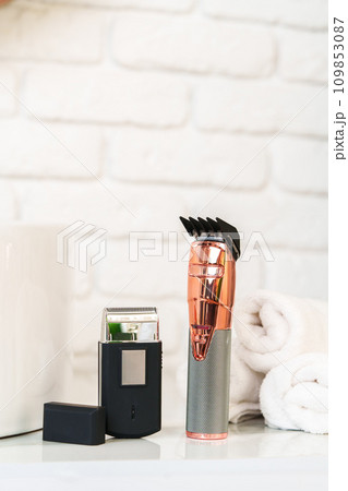 Electric shaver for men in a bathroom close up Electric shaver for men in a bathroom close up 109853087