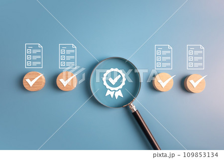 Quality assurance checklist, ISO standard, best quality score and product warranty concept.wooden block and magnifier with business icons. Quality assurance checklist, ISO standard, best quality score and product warranty concept.wooden block and magnifier with business icons. 109853134