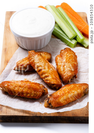 Buffalo spicy chicken wings with cayenne pepper sauce isolated on white background 109854310