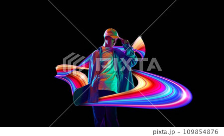 Teen boy posing with skateboard against black background in neon lights with colorful abstract element. Creative design. 109854876