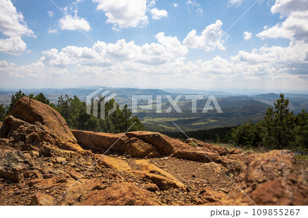 Panoramic view from the mountain peak of the landscape and amazing blue cloudy sky. Divcibare mountain in Serbia 109855267