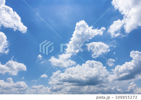 White fluffy clouds in the bright blue sky White fluffy clouds in the bright blue sky 109855272