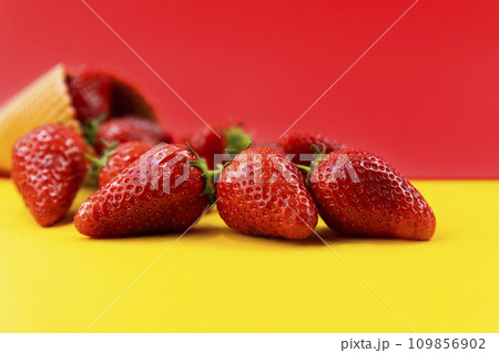 Ice cream cone with strawberries. Strawberry icecream. Healthy summer food concept 109856902