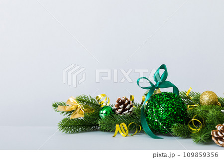 New Year Christmas tree toy, branches of a christmas tree, New Year decorations on a colored background New Year Christmas tree toy, branches of a christmas tree, New Year decorations on a colored background 109859356