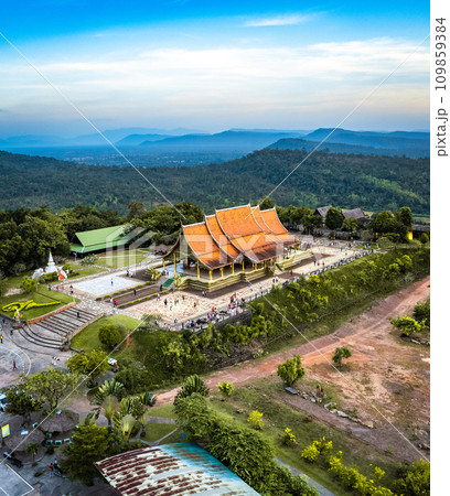 Aerial view of Wat Sirindhorn Wararam glowing temple in Ubon, Thailand 109859384