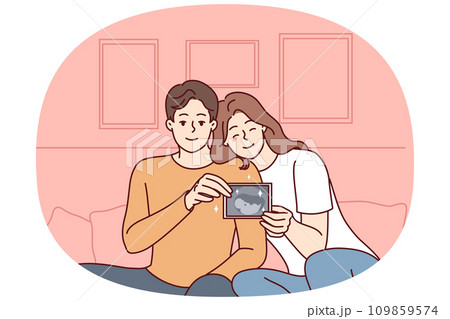 Smiling couple showing baby ultrasound 109859574